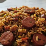 easy flavorful cajun sausage and rice skillet in o featured