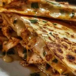 Cheesy Hot Honey Chicken Quesadillas with Spicy Jalapeño Cream Sauce